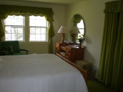 3275 Conner Grove Road Southwest Willis, VA 24380 - Photo 11 of 17 a bedroom with bed and a chandelier