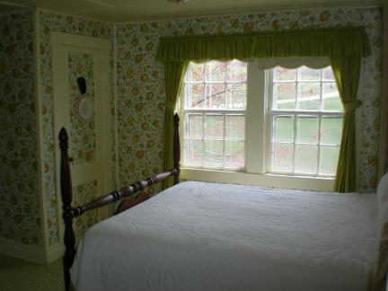 3275 Conner Grove Road Southwest Willis, VA 24380 - Photo 13 of 17 a bed sitting in a bedroom next to a window
