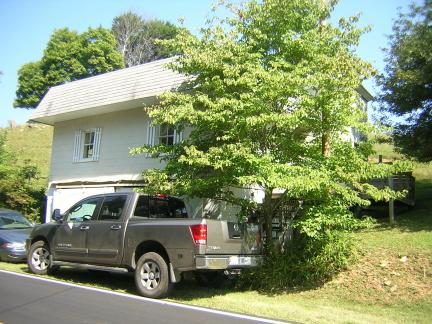 3275 Conner Grove Road Southwest Willis, VA 24380 - Photo 15 of 17 a view of a car parked front of a house