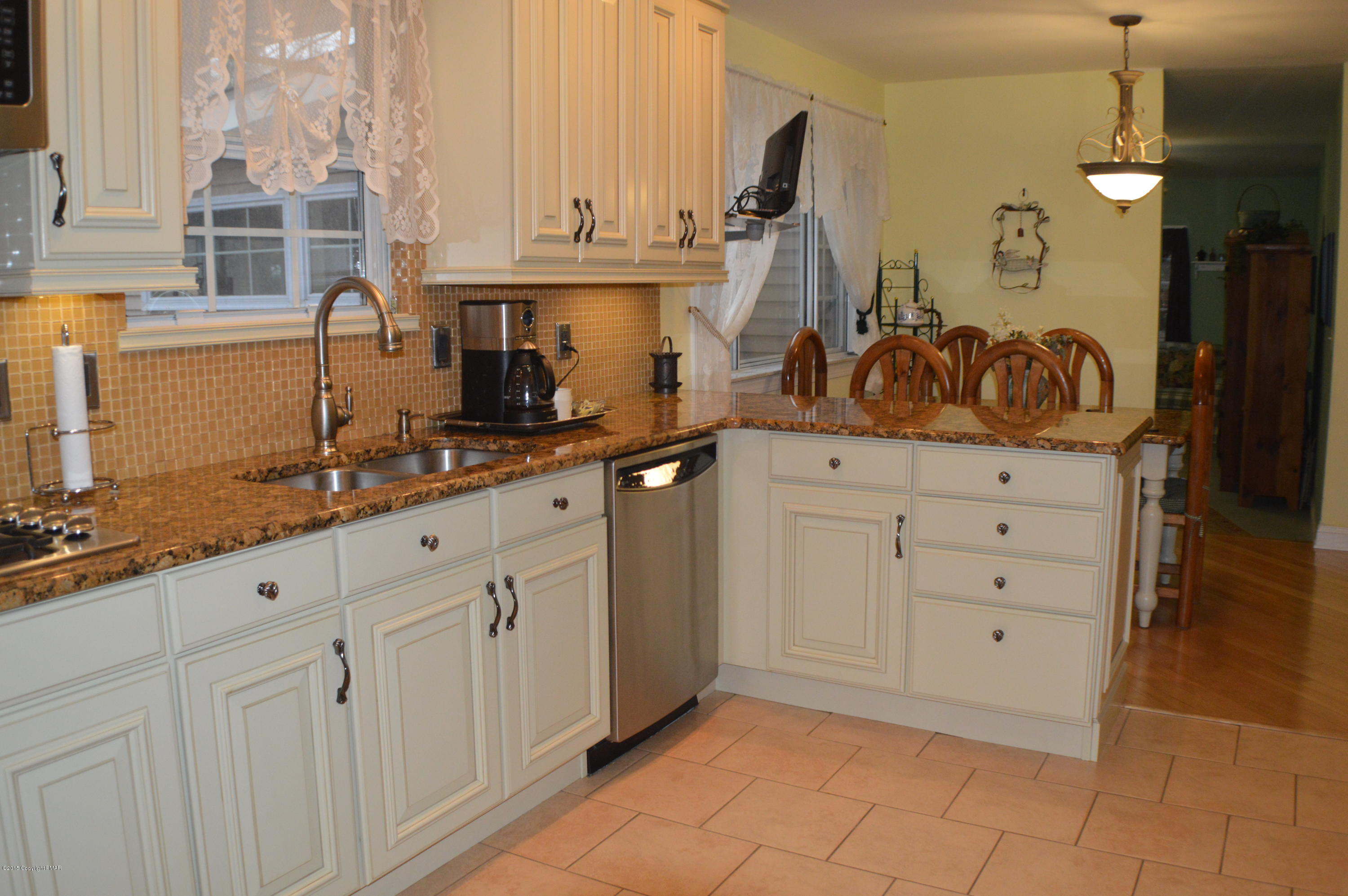2105 Laurel Ridge Road East Stroudsburg, PA 18302 - Photo 13 of 82 a kitchen with granite countertop white cabinets and white appliances