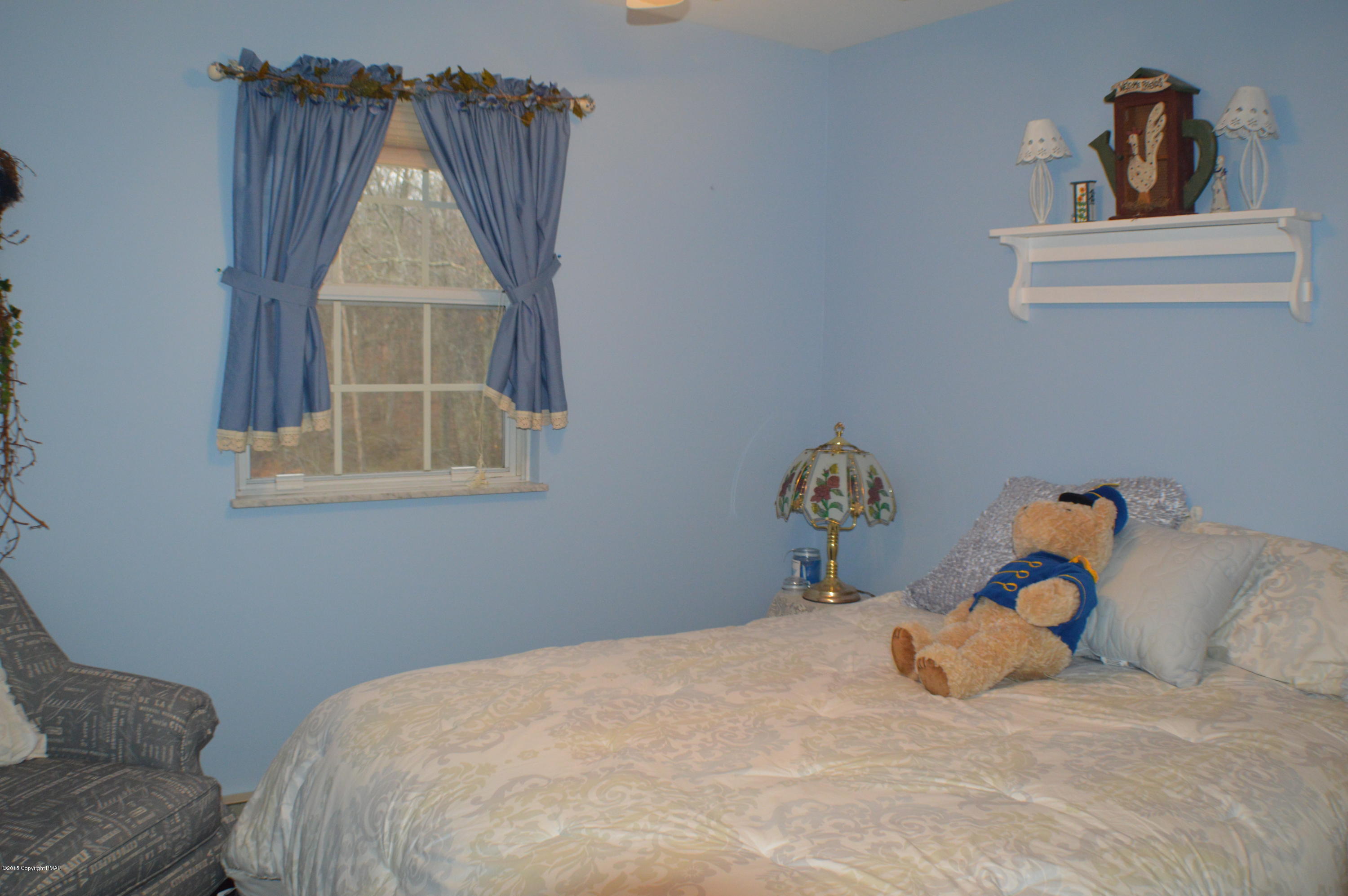 2105 Laurel Ridge Road East Stroudsburg, PA 18302 - Photo 49 of 82 a bedroom with a bed and a window