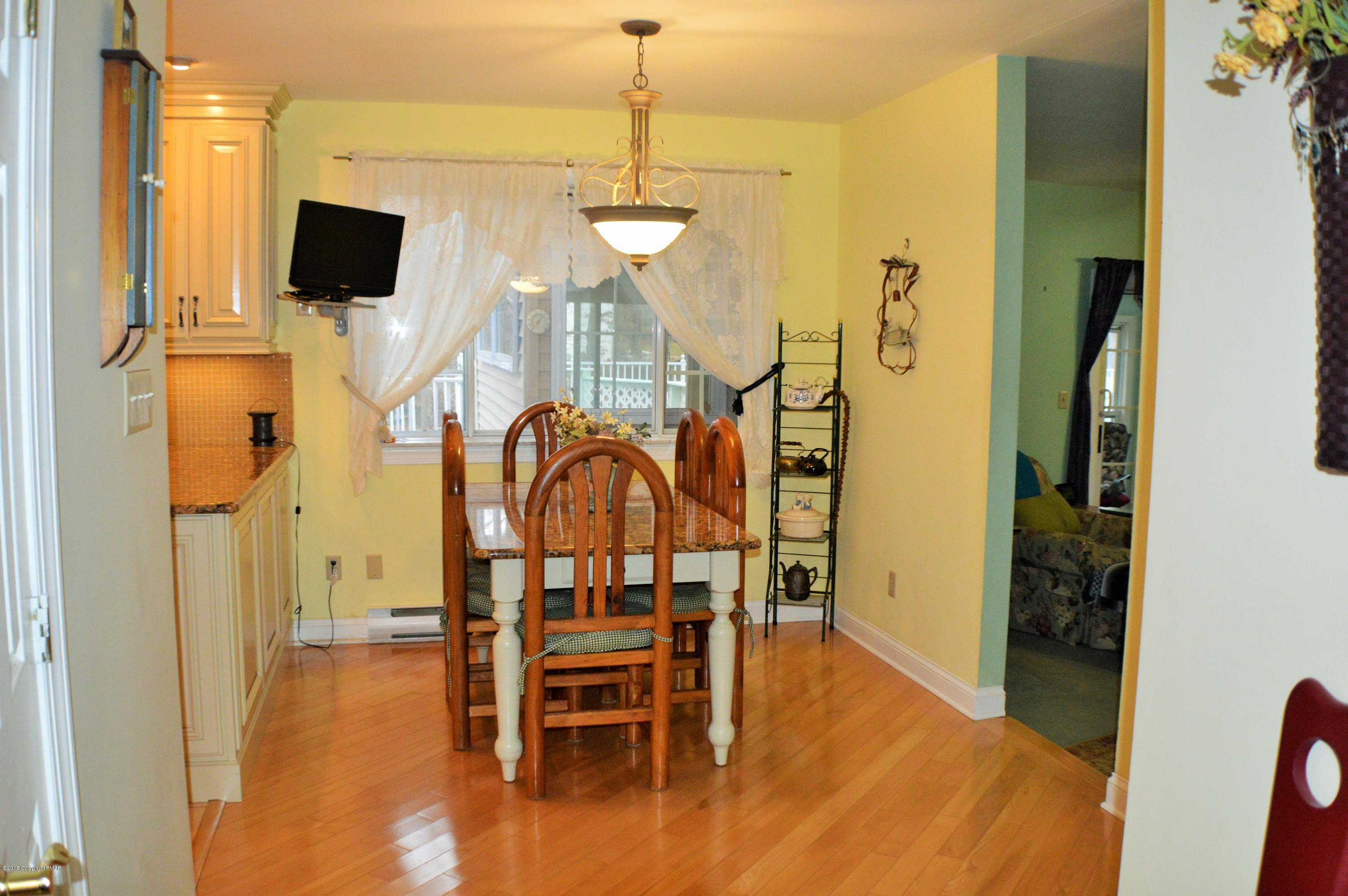 2105 Laurel Ridge Road East Stroudsburg, PA 18302 - Photo 5 of 82 a view of a dining room with furniture and wooden floor
