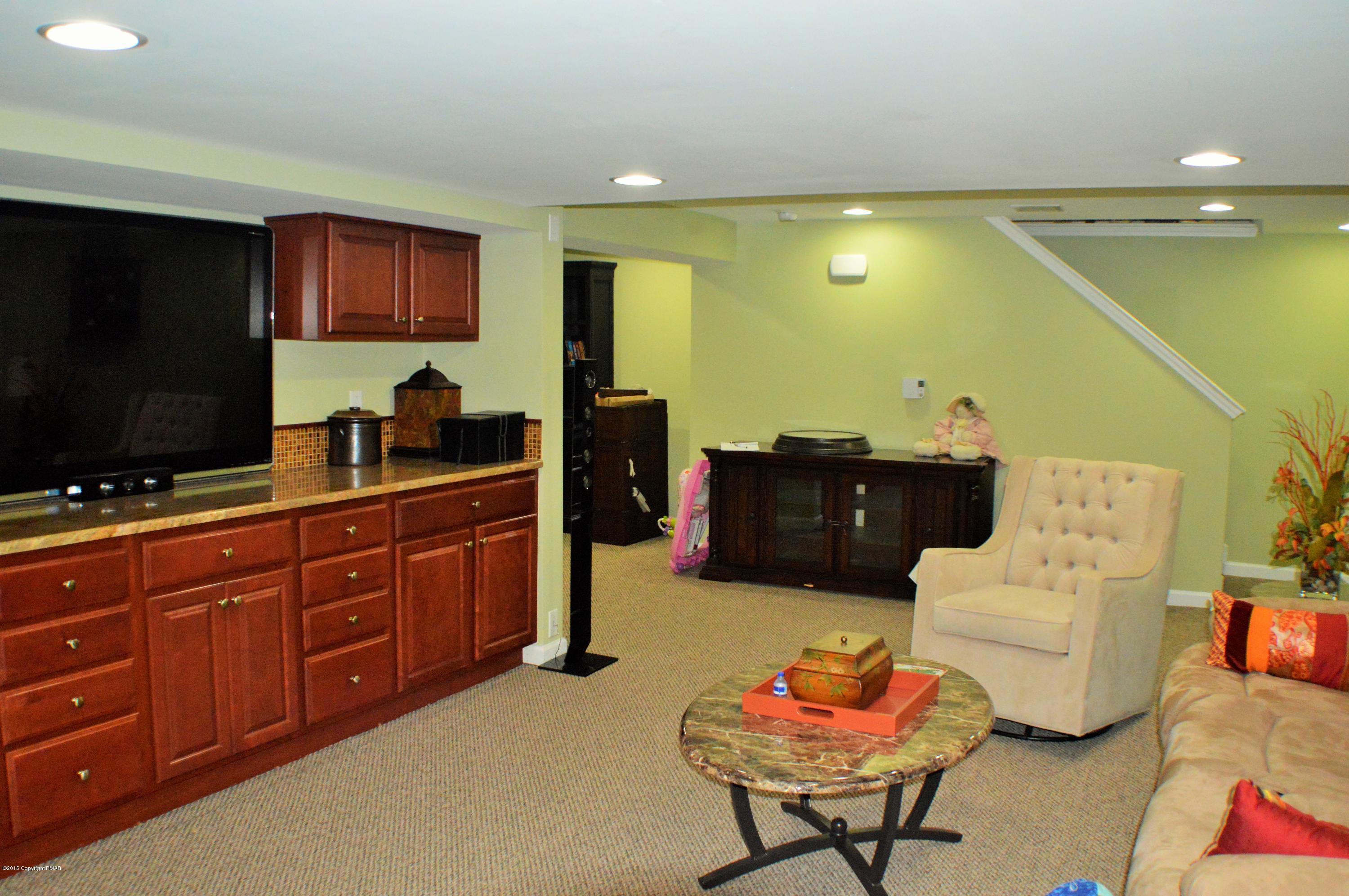 2105 Laurel Ridge Road East Stroudsburg, PA 18302 - Photo 61 of 82 a living room with furniture and a flat screen tv