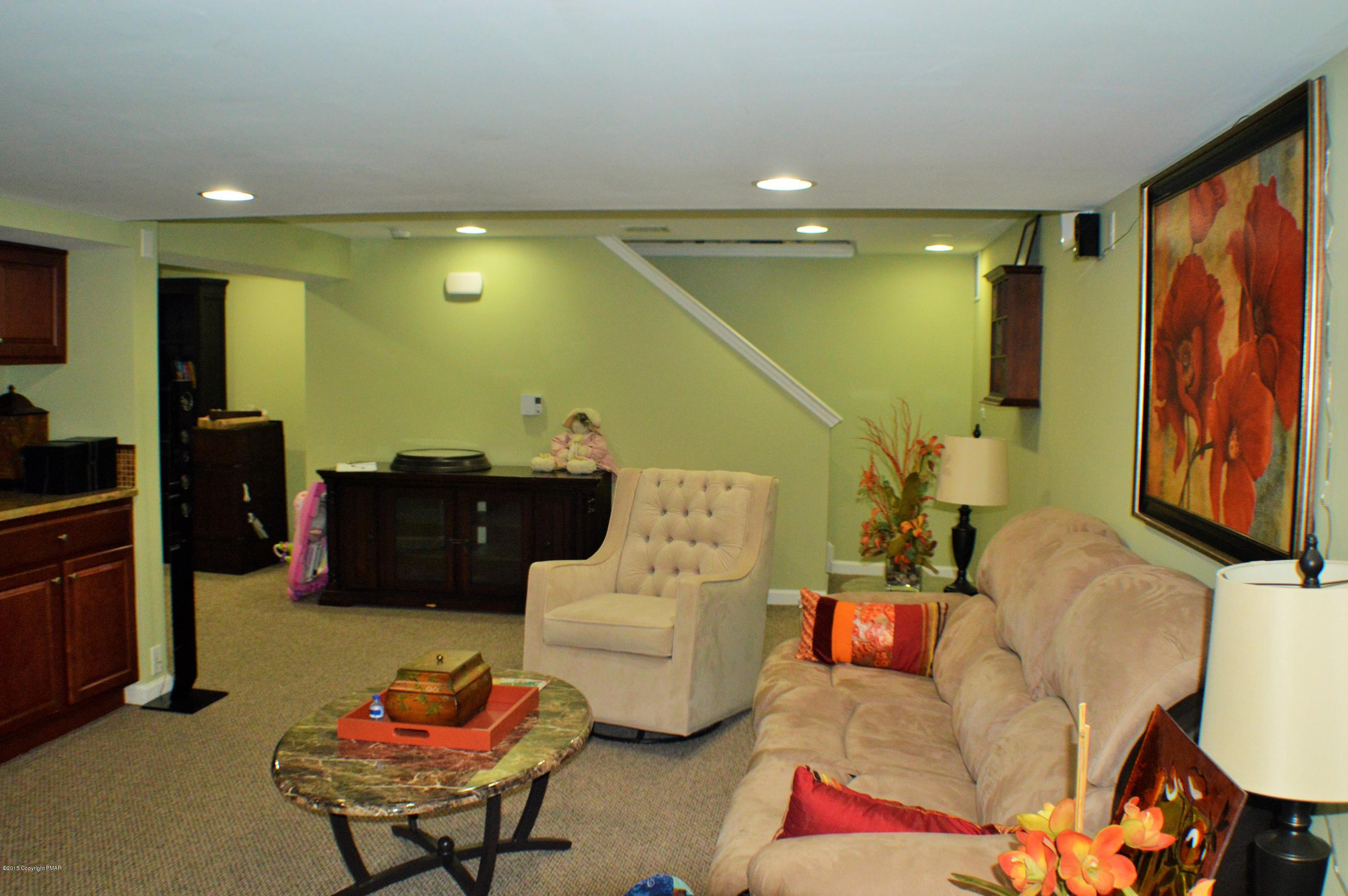 2105 Laurel Ridge Road East Stroudsburg, PA 18302 - Photo 62 of 82 a living room with furniture and a flat screen tv