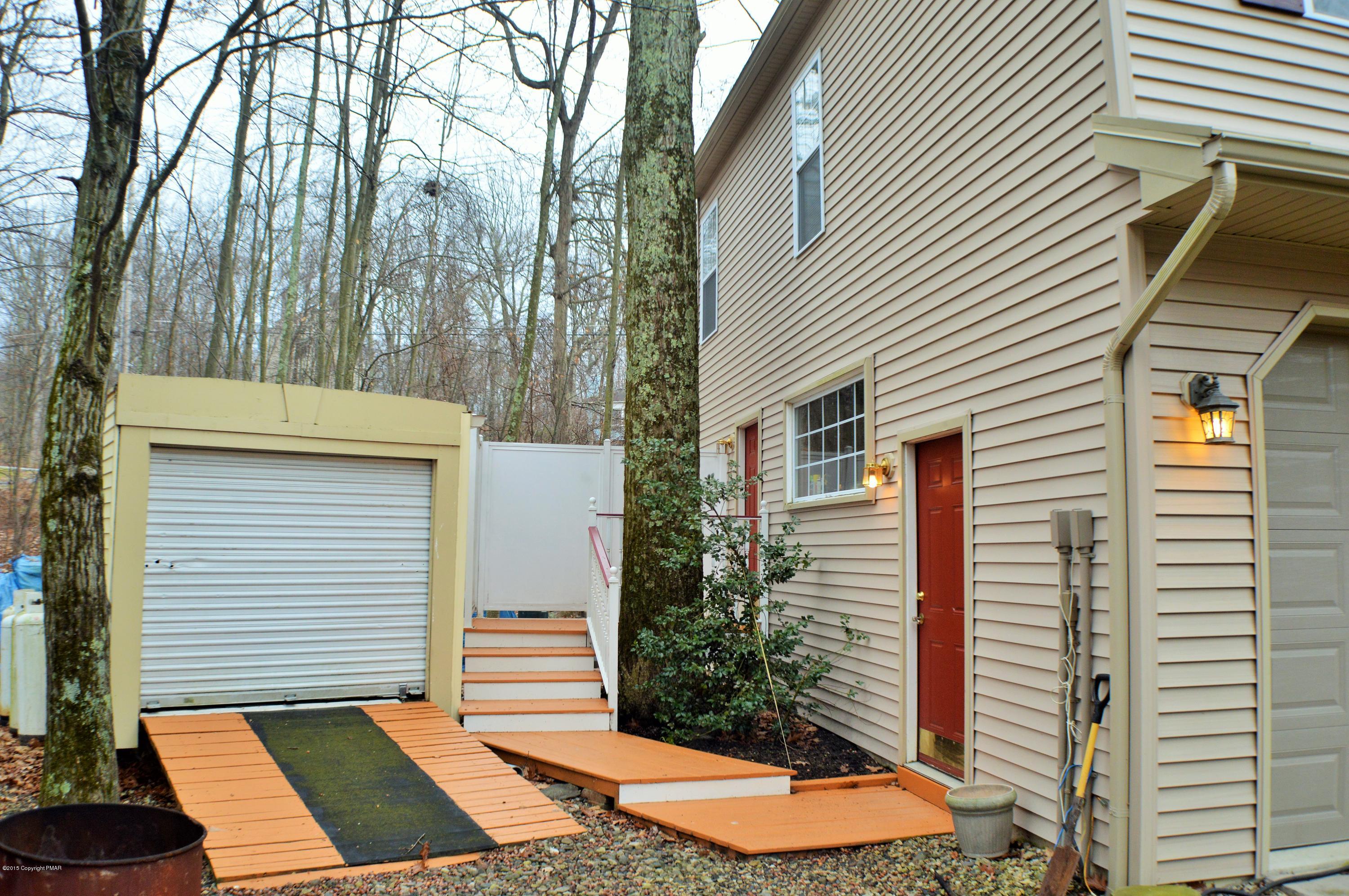 2105 Laurel Ridge Road East Stroudsburg, PA 18302 - Photo 77 of 82 a view of a backyard with a small cabin