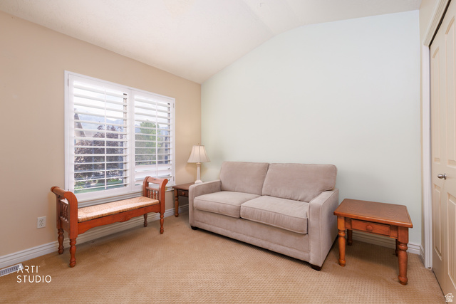 6761 950 East Midvale, UT 84047 - Photo 18 of 44 Room featuring a vaulted ceiling and a window with white louvered shutters