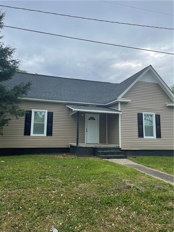 a house with garden in front of it