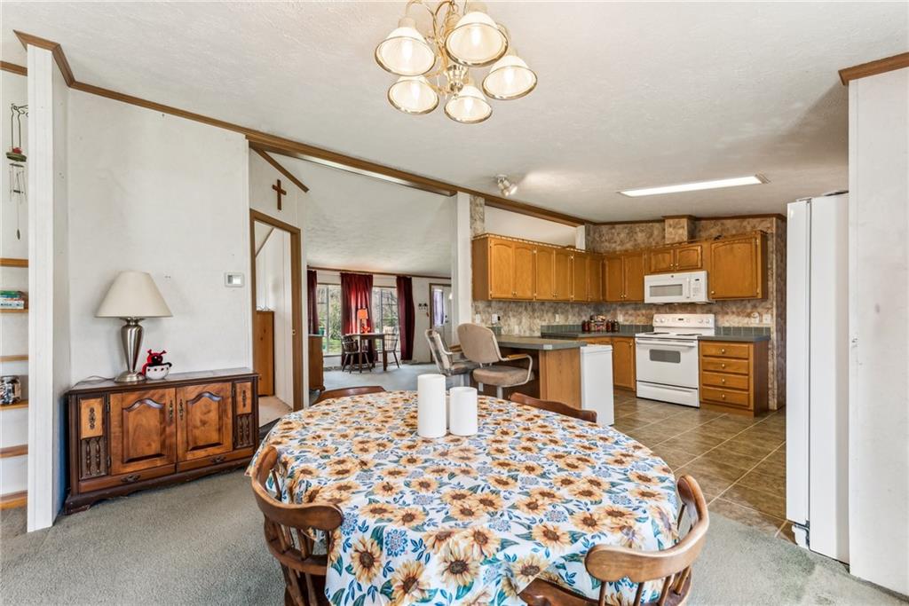 176 Seger Road Derry, PA 15627 - Photo 14 of 41 a bed room with a bed mirror and a dresser