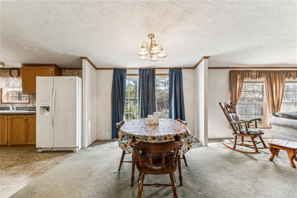 176 Seger Road Derry, PA 15627 - Photo 15 of 41 a dining room with furniture and window