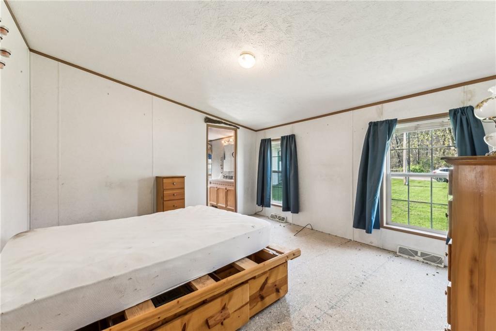 176 Seger Road Derry, PA 15627 - Photo 16 of 41 a bedroom with a bed and window