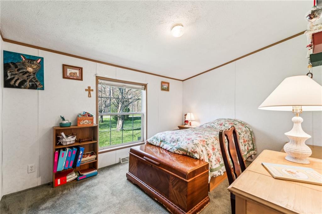 176 Seger Road Derry, PA 15627 - Photo 19 of 41 a bed room with furniture and a window