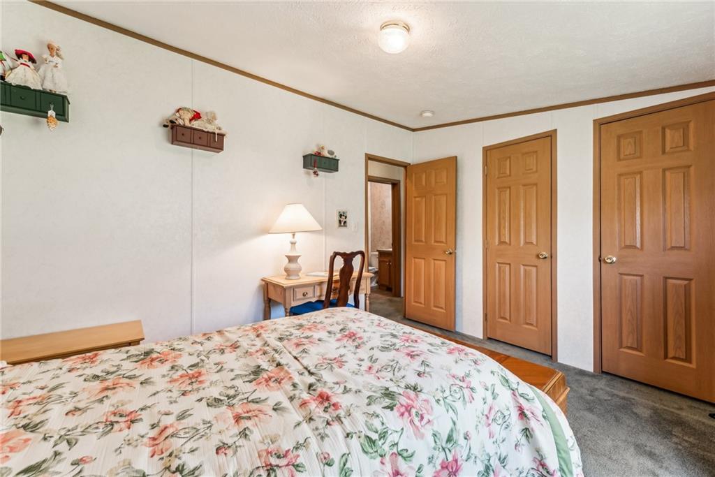 176 Seger Road Derry, PA 15627 - Photo 20 of 41 a bedroom with a bed and a dresser