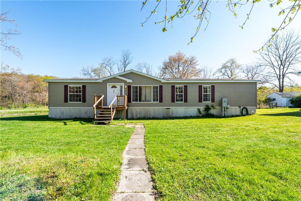 176 Seger Road Derry, PA 15627 - Photo 2 of 41 a front view of a house with a garden