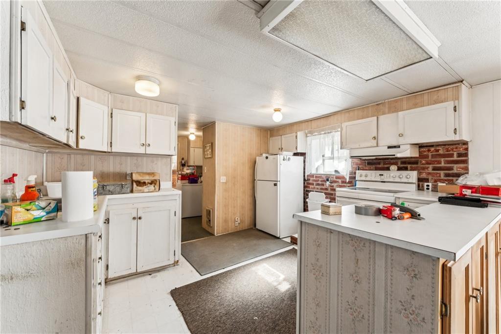 176 Seger Road Derry, PA 15627 - Photo 34 of 41 a kitchen that has a lot of cabinets and refrigerator