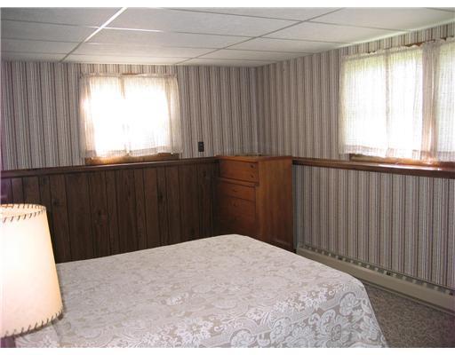 79 Crosby Road Albion, ME 04910 - Photo 6 of 12 Bedroom. one of three bedrooms
