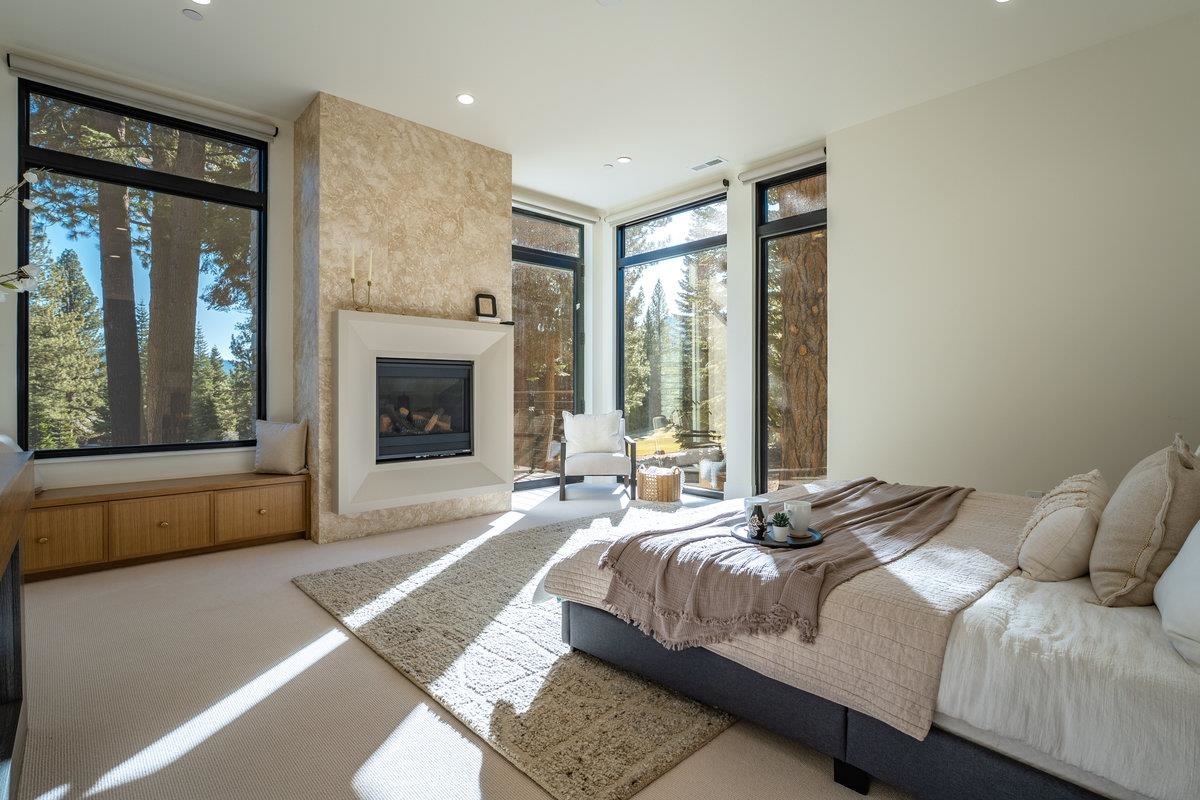9308 Nine Bark Road Truckee, CA 96161 - Photo 12 of 28 a bedroom with a large bed and a large window