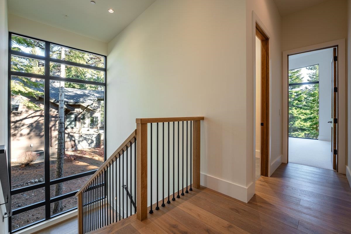 9308 Nine Bark Road Truckee, CA 96161 - Photo 18 of 28 a view of a room with wooden floor and windows