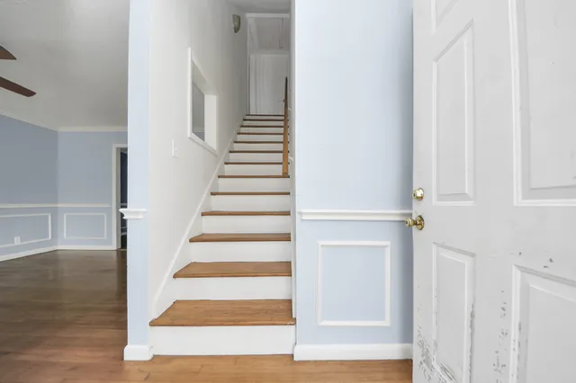 a view of an entryway with wooden floor