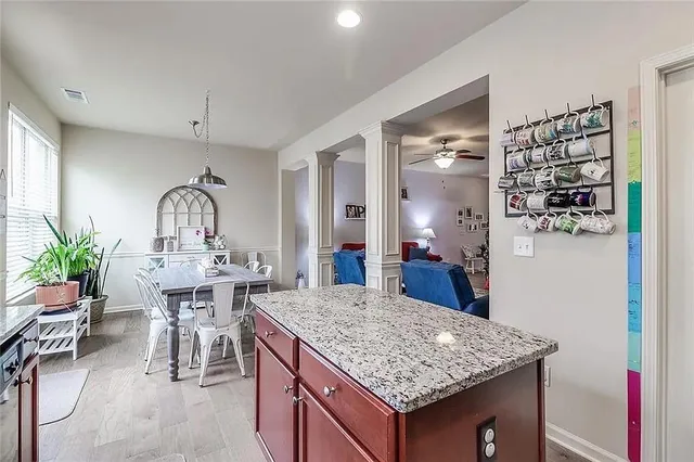a view of living room with granite countertop furniture and fireplace