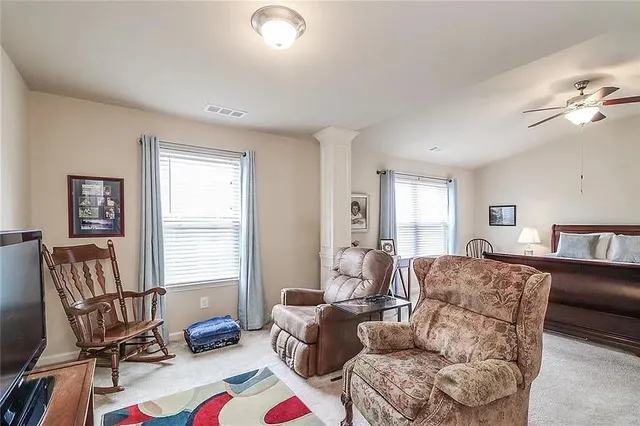 a living room with furniture and a window