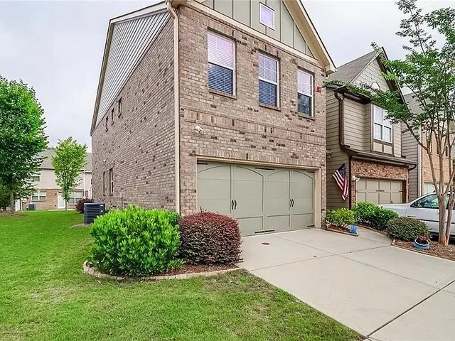 a view of a house with a garden