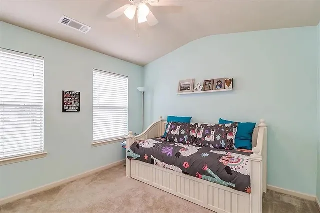 a bed room with furniture and a window
