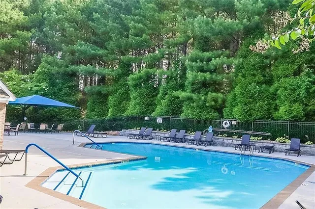 a view of a swimming pool with chairs