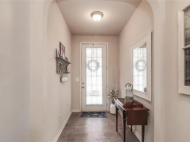 a view of a room with furniture window and wooden floor