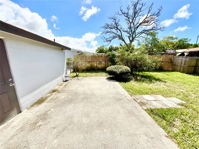 a view of backyard with outdoor space