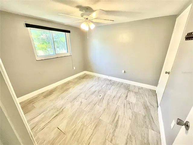 a view of an empty room with a window
