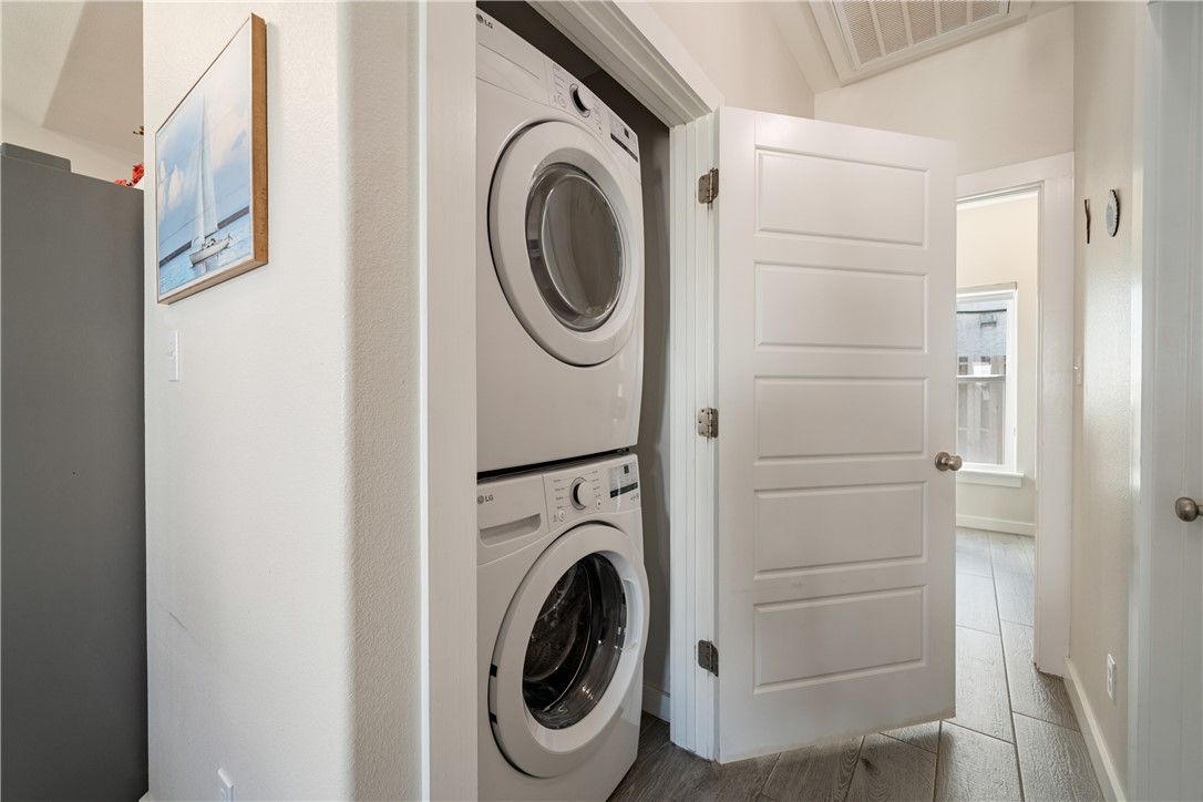 15113 Kokomo Drive Corpus Christi, TX 78418 - Photo 11 of 25 a utility room with dryer and washer