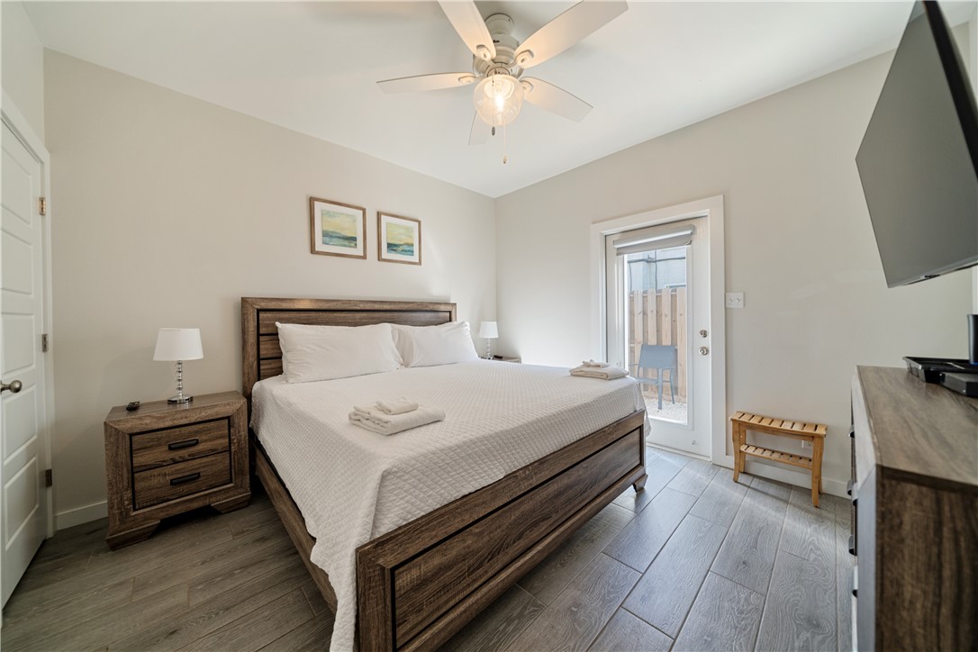 15113 Kokomo Drive Corpus Christi, TX 78418 - Photo 15 of 25 a bedroom with a bed and a tv on the dresser