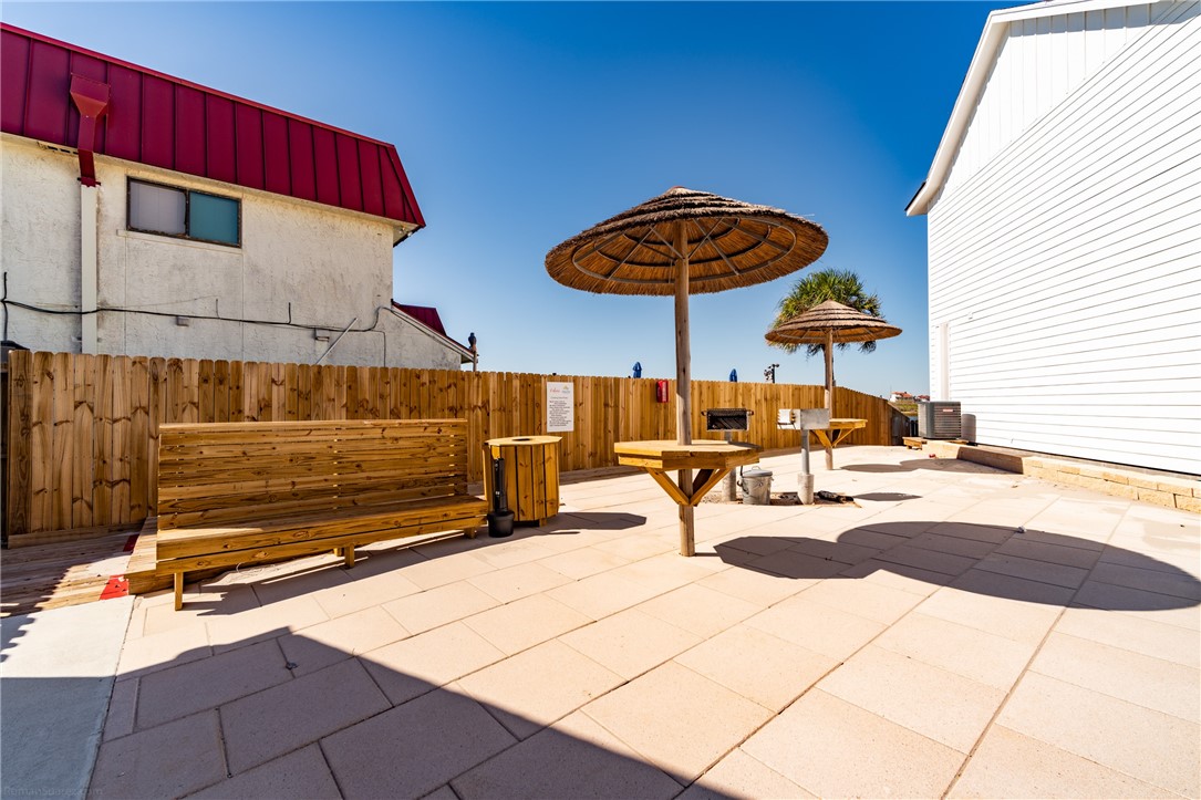 15113 Kokomo Drive Corpus Christi, TX 78418 - Photo 20 of 25 a view of a patio with a table and chairs