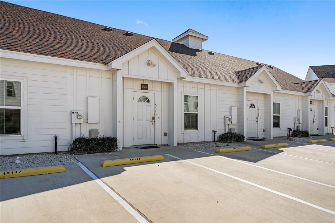 15113 Kokomo Drive Corpus Christi, TX 78418 - Photo 2 of 25 a front view of a house with a yard