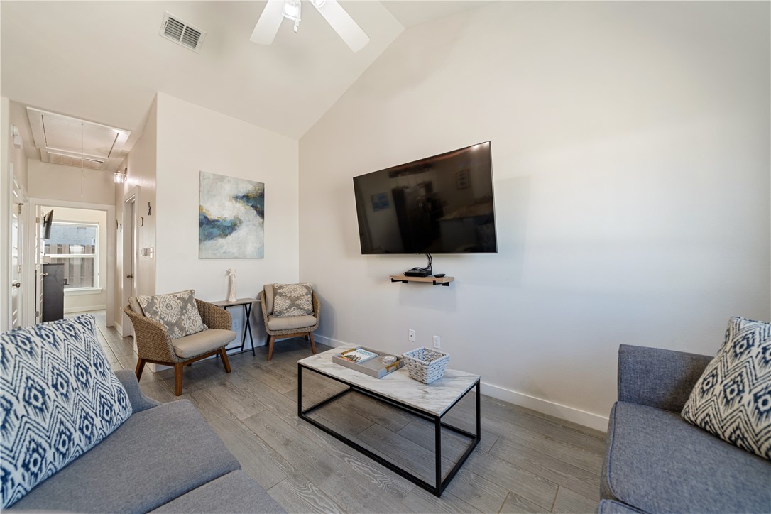 15113 Kokomo Drive Corpus Christi, TX 78418 - Photo 3 of 25 a living room with furniture and a flat screen tv