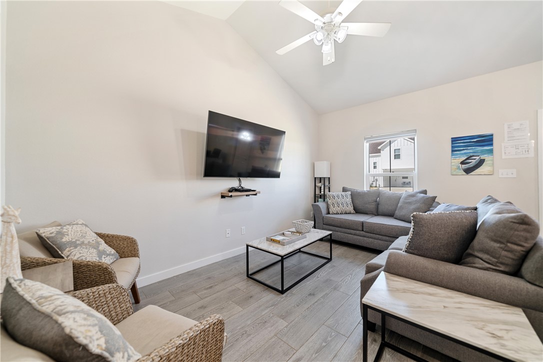 15113 Kokomo Drive Corpus Christi, TX 78418 - Photo 4 of 25 a living room with furniture and a flat screen tv