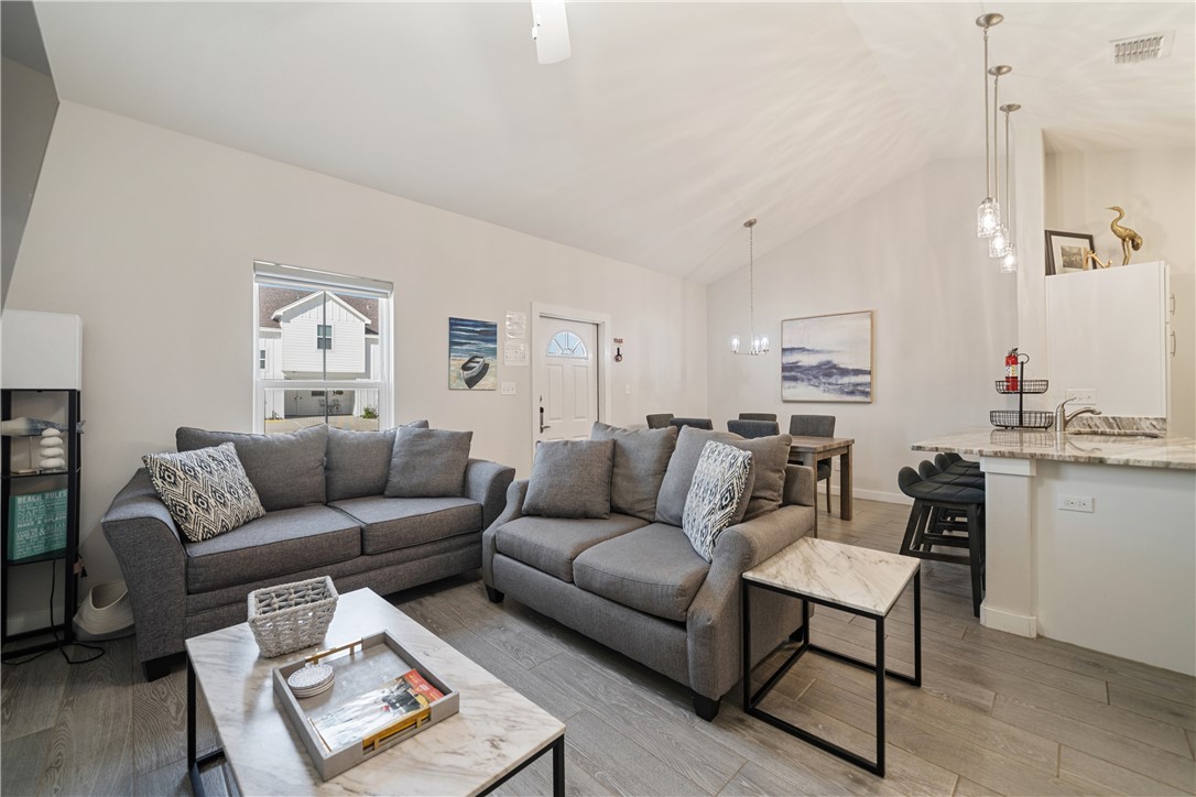 15113 Kokomo Drive Corpus Christi, TX 78418 - Photo 5 of 25 a living room with furniture a rug and a window
