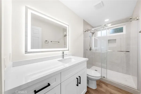 a bathroom with a double vanity sink and mirror