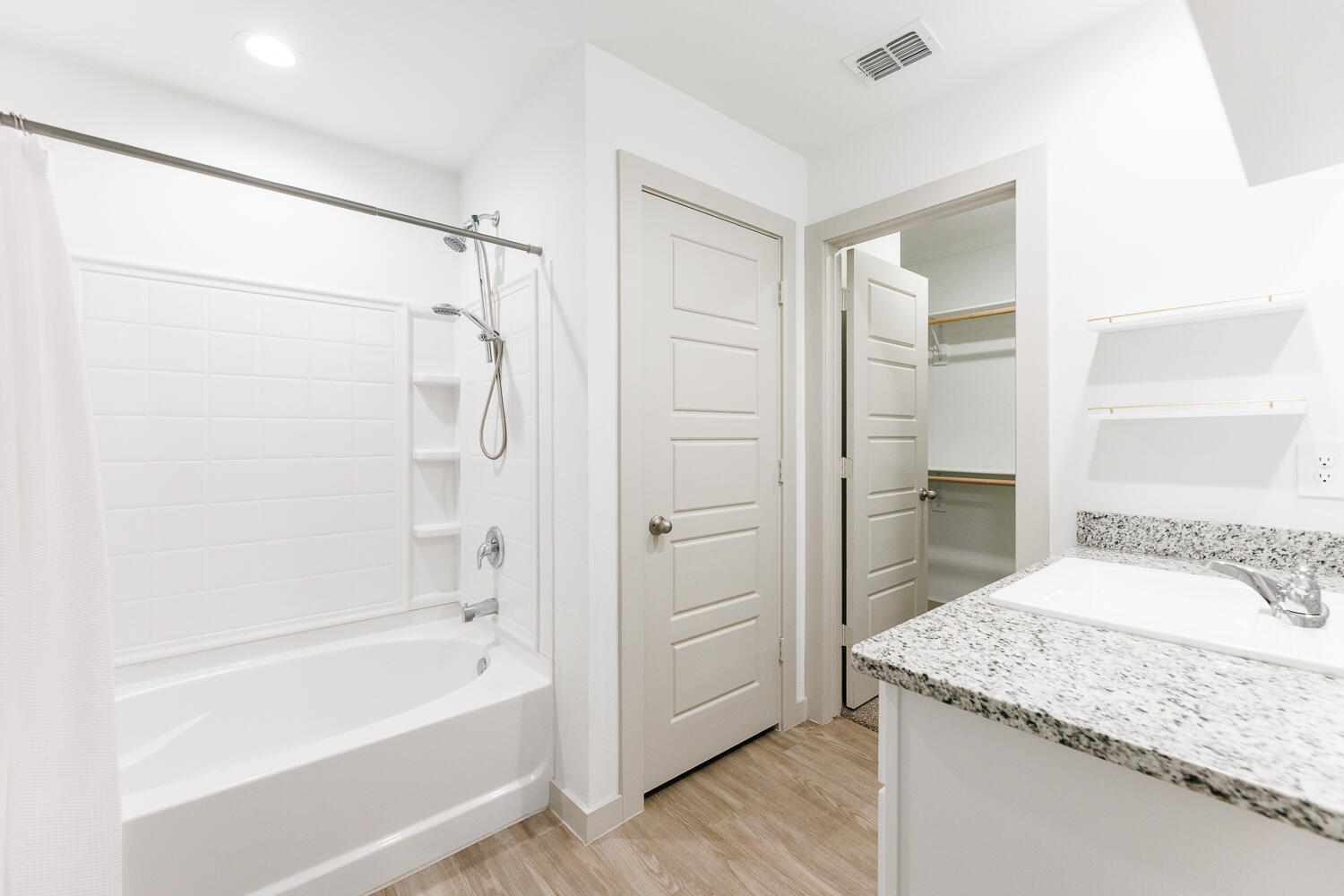 2305 150th Street Lubbock, TX 79423 - Photo 21 of 39 a bathroom with a granite countertop sink a toilet and shower