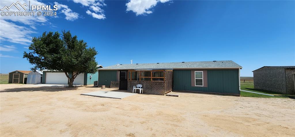 36925 Shear Road Yoder, CO 80864 - Photo 1 of 34 a view of a house with a yard