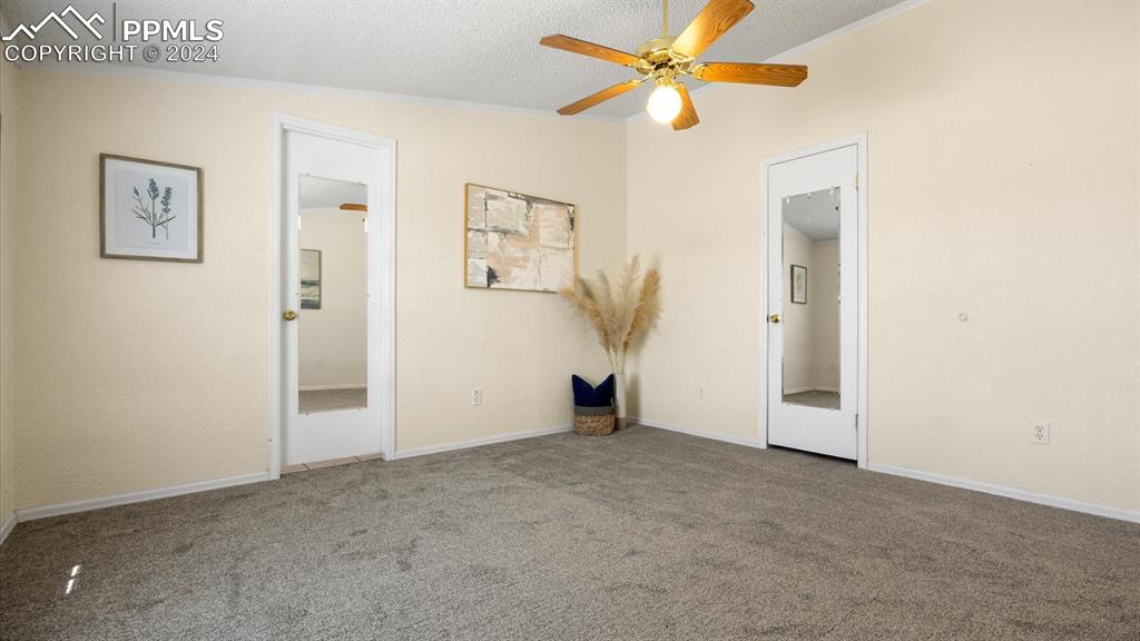 36925 Shear Road Yoder, CO 80864 - Photo 17 of 34 an empty room with closet and a ceiling fan