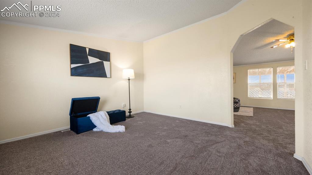 36925 Shear Road Yoder, CO 80864 - Photo 18 of 34 a living room with furniture and a flat screen tv
