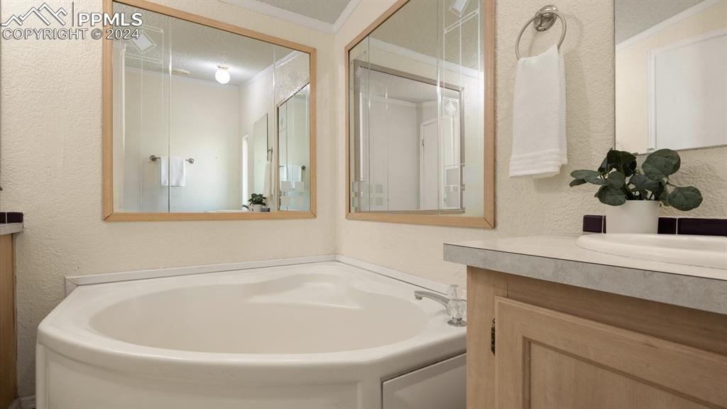 36925 Shear Road Yoder, CO 80864 - Photo 22 of 34 a bathroom with a bathtub and a sink