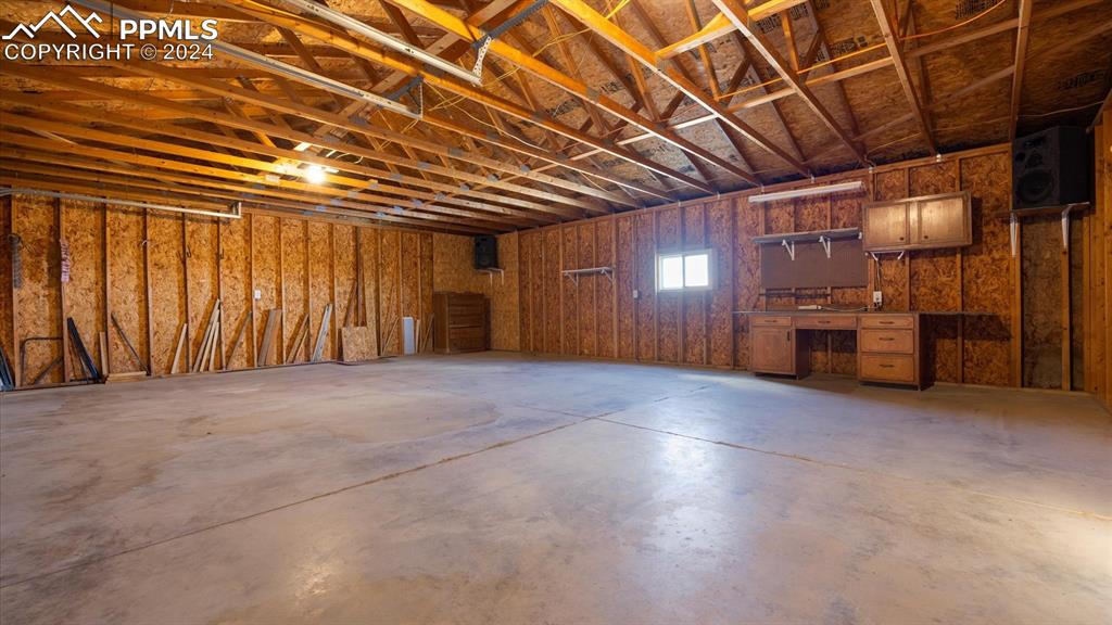 36925 Shear Road Yoder, CO 80864 - Photo 7 of 34 a view of an empty room with furniture and a kitchen