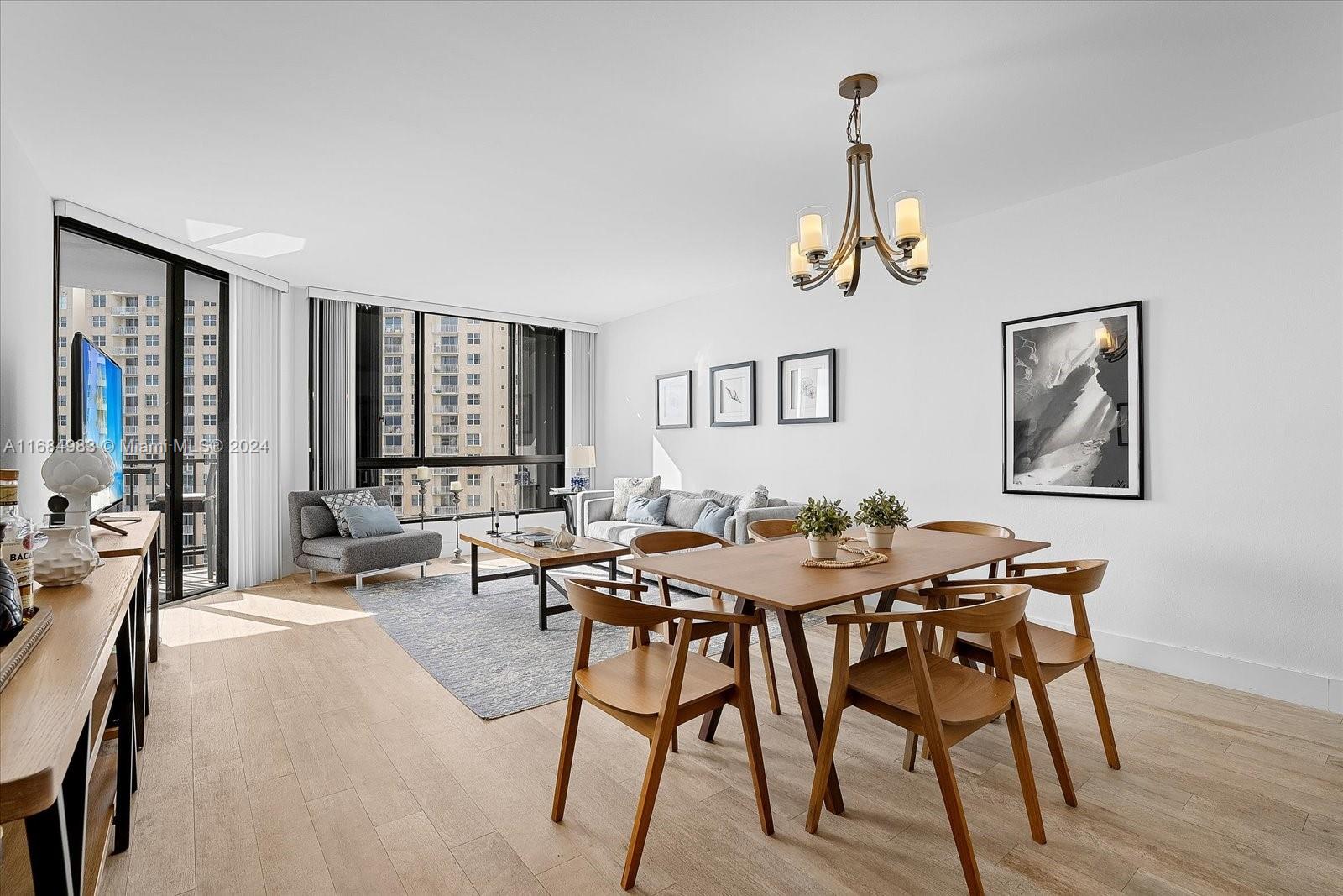 520 Brickell Key Drive, Unit A1513 Miami, FL 33131 - Photo 4 of 22 a view of a livingroom with furniture and window