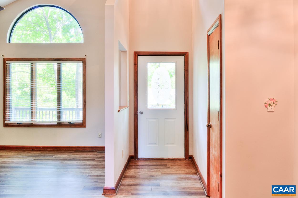 34 Amethyst Road Palmyra, VA 22963 - Photo 3 of 31 an empty room with wooden floor and a window