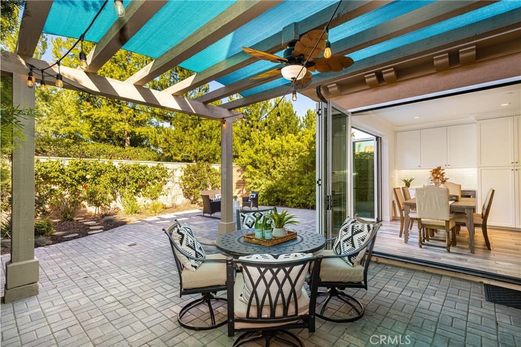 57 Bandana Irvine, CA 92602 - Photo 11 of 32 a view of a patio with table and chairs and potted plants