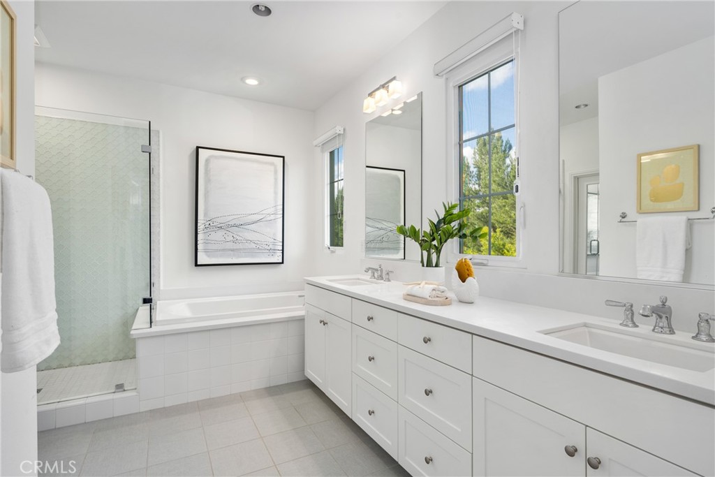 57 Bandana Irvine, CA 92602 - Photo 15 of 32 a bathroom with a granite countertop sink mirror and bathtub