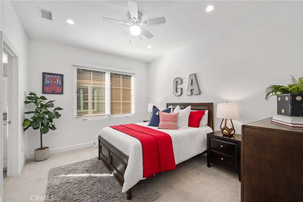 57 Bandana Irvine, CA 92602 - Photo 17 of 32 a bedroom with a bed and a potted plant