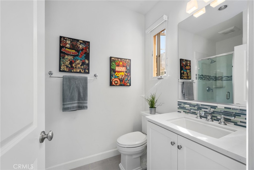 57 Bandana Irvine, CA 92602 - Photo 18 of 32 a bathroom with a toilet sink and mirror